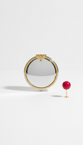 Polished silver compact mirror with gold accent